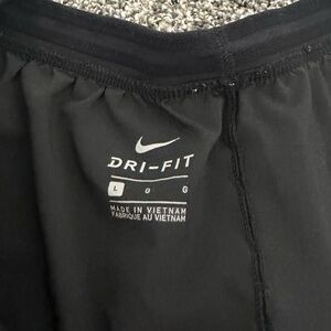 Women’s size large black Nike shorts.
